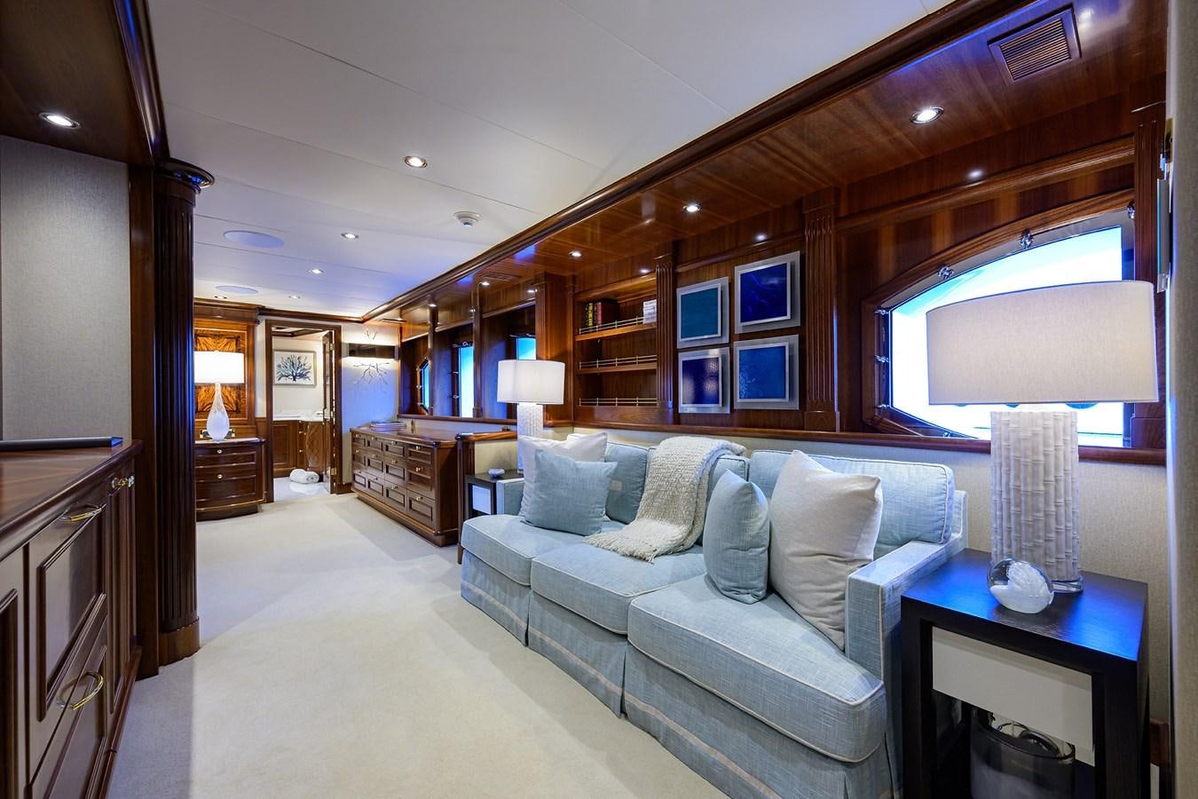 a living room with a couch and a tv aboard REVIVE Yacht for Sale