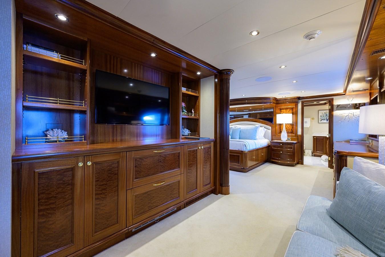 a bedroom with a large mirror aboard REVIVE Yacht for Sale