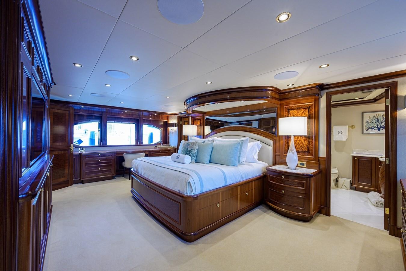 a bedroom with a large bed aboard REVIVE Yacht for Sale