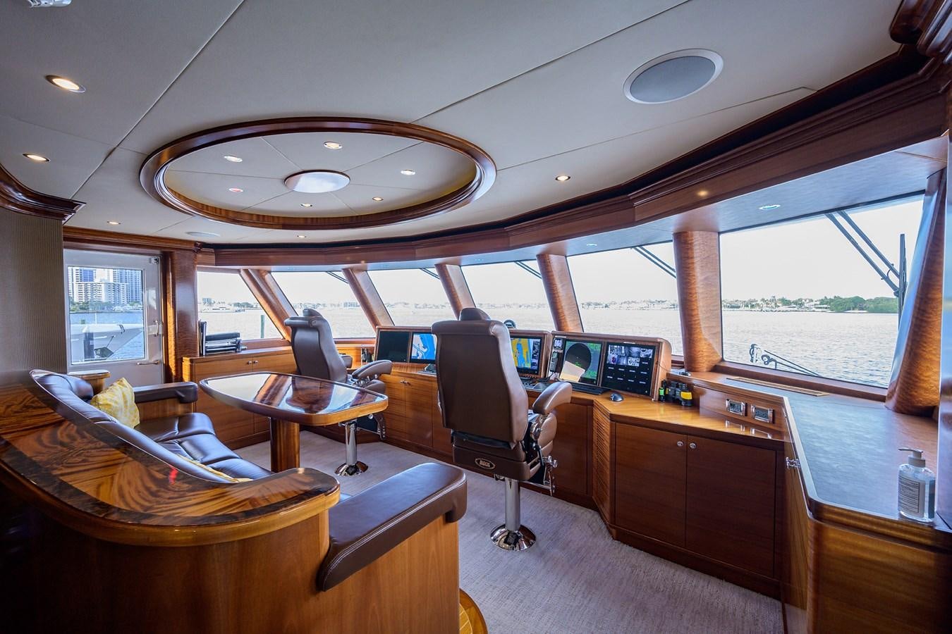 inside of a building with a large window and a view of the water aboard REVIVE Yacht for Sale