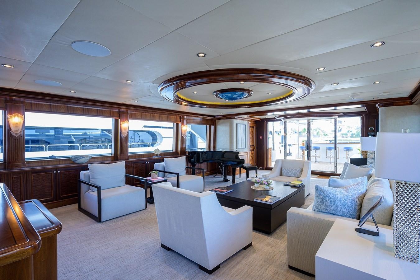 a large living room with a large glass ceiling aboard REVIVE Yacht for Sale
