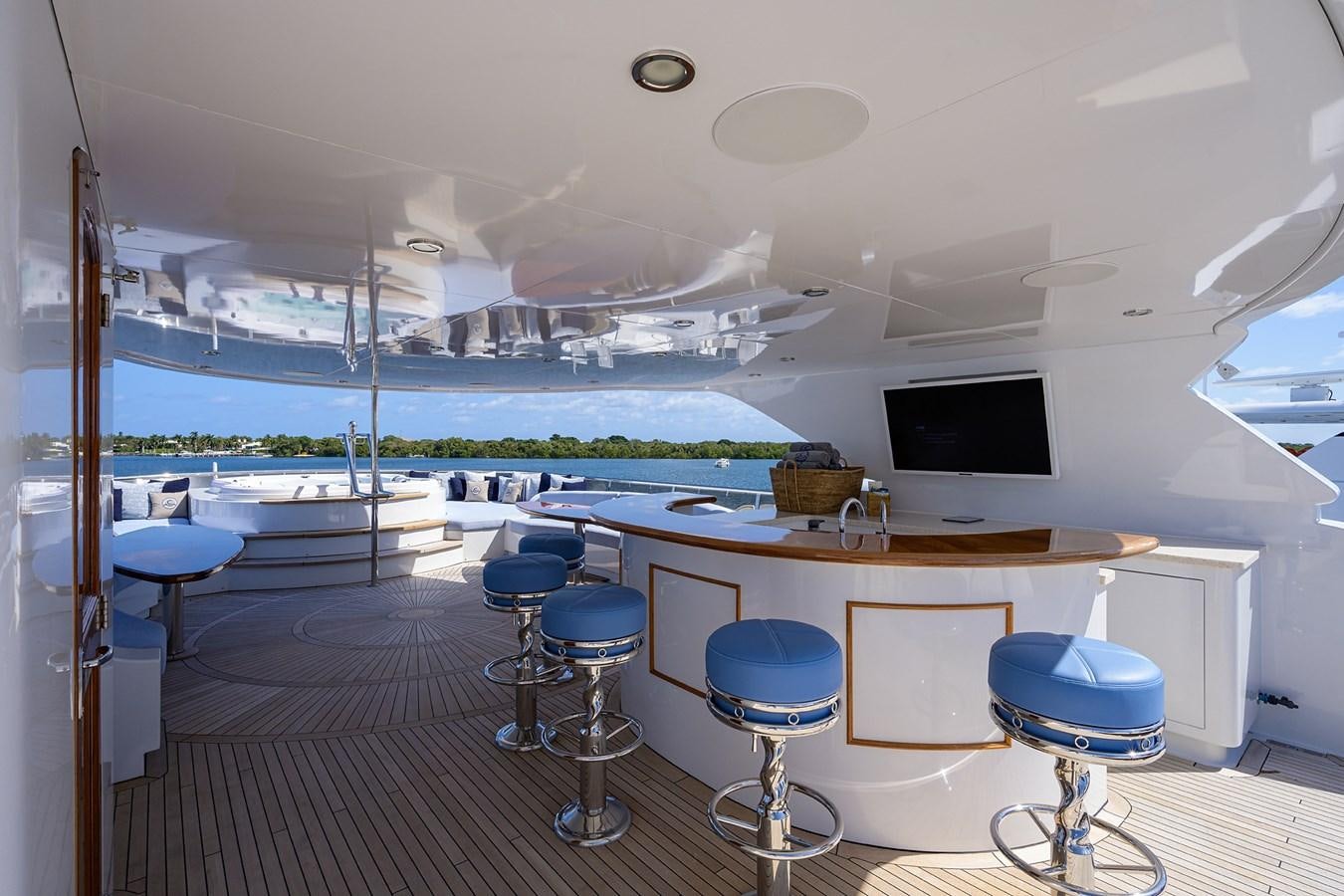 a room with a table and chairs aboard REVIVE Yacht for Sale