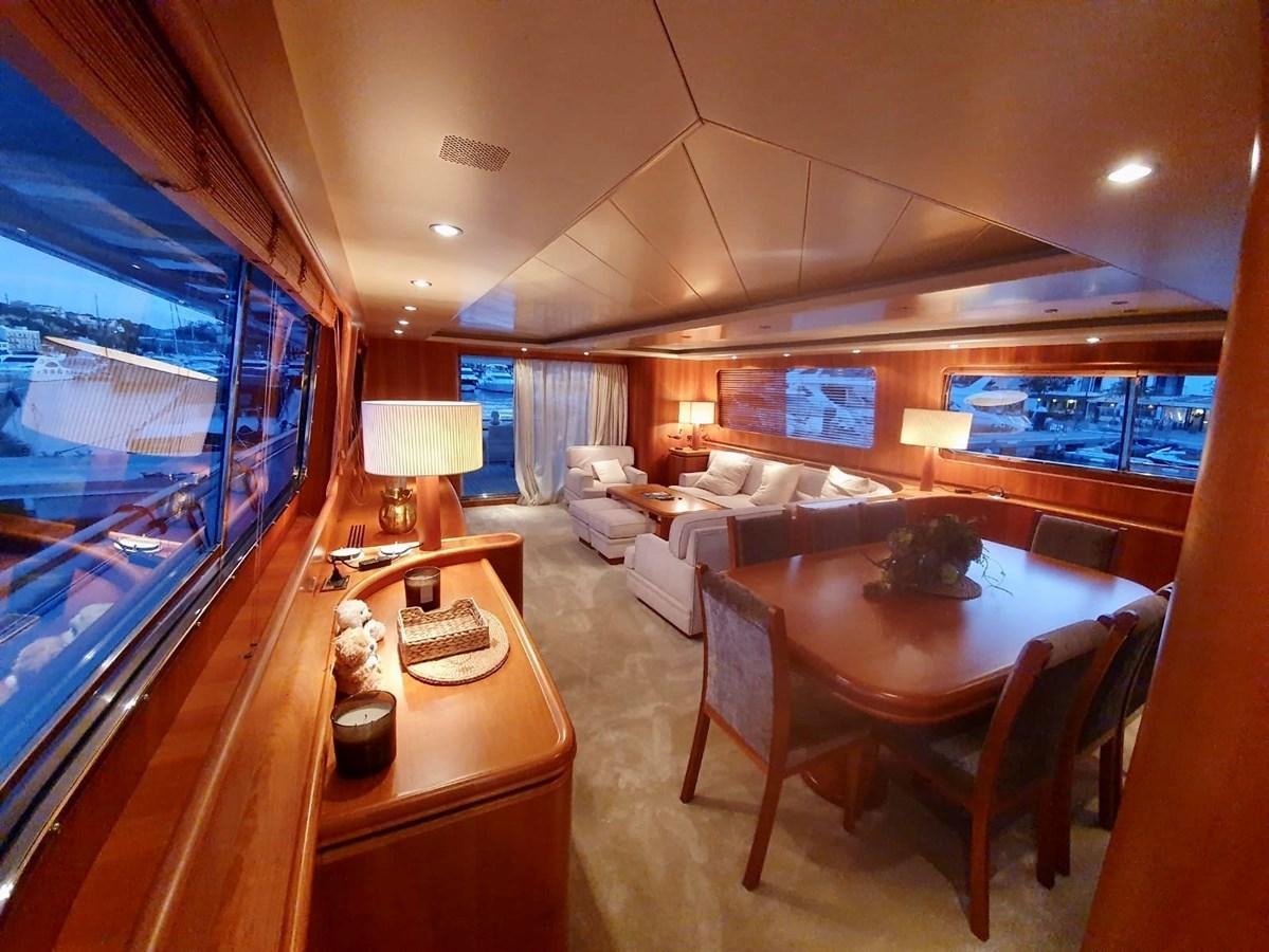 a living room with a large window aboard P Yacht for Sale