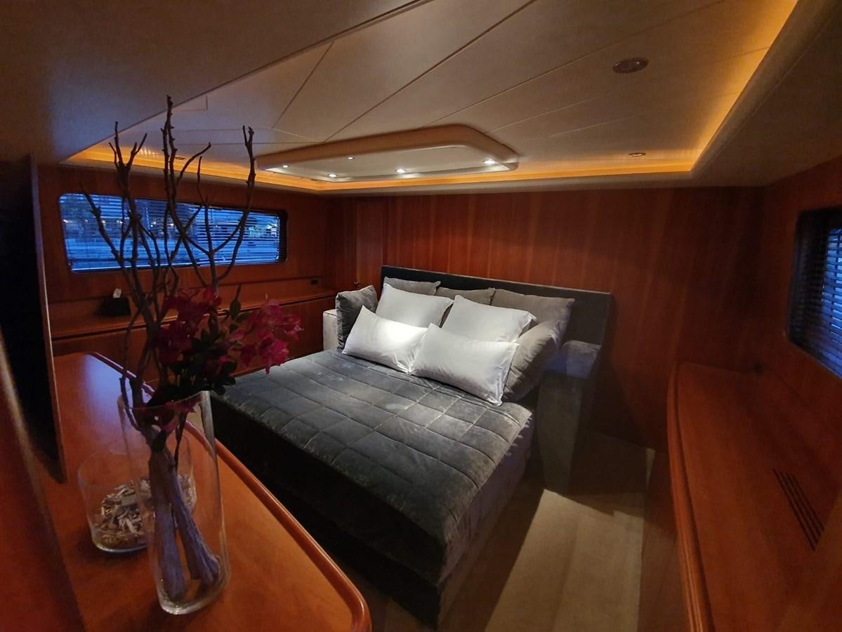 a bed in a room aboard P Yacht for Sale