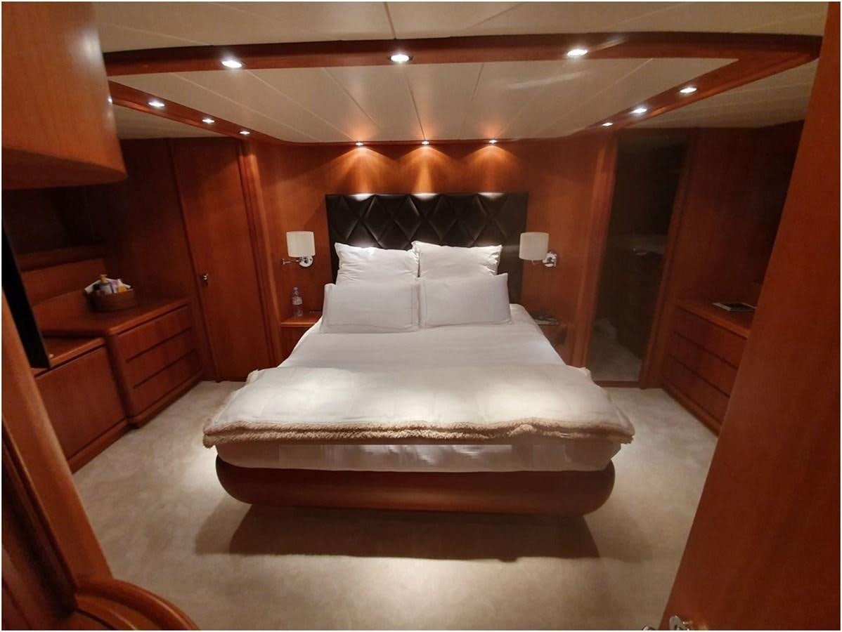 a bed in a room aboard P Yacht for Sale