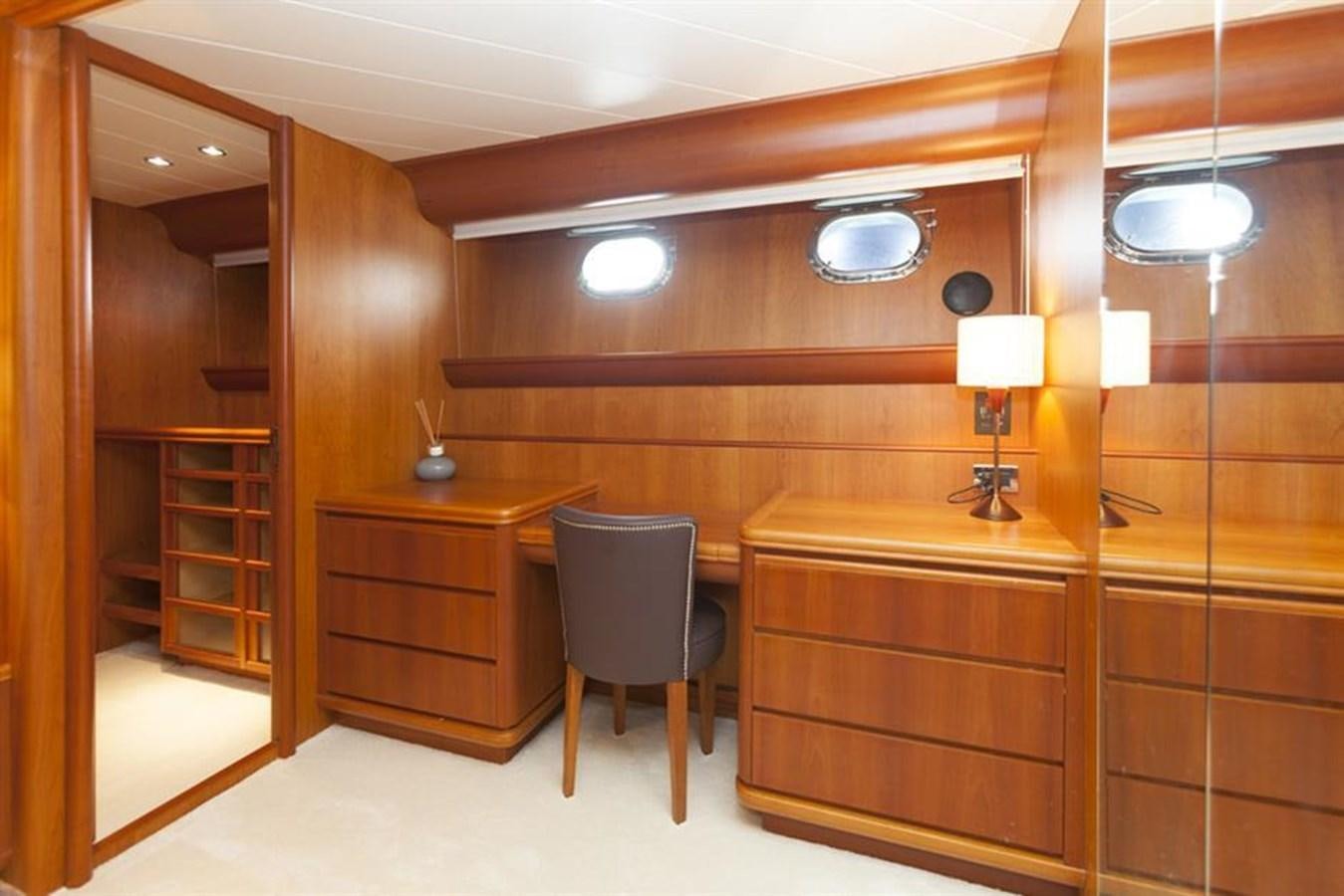 a room with a desk and a chair aboard P Yacht for Sale