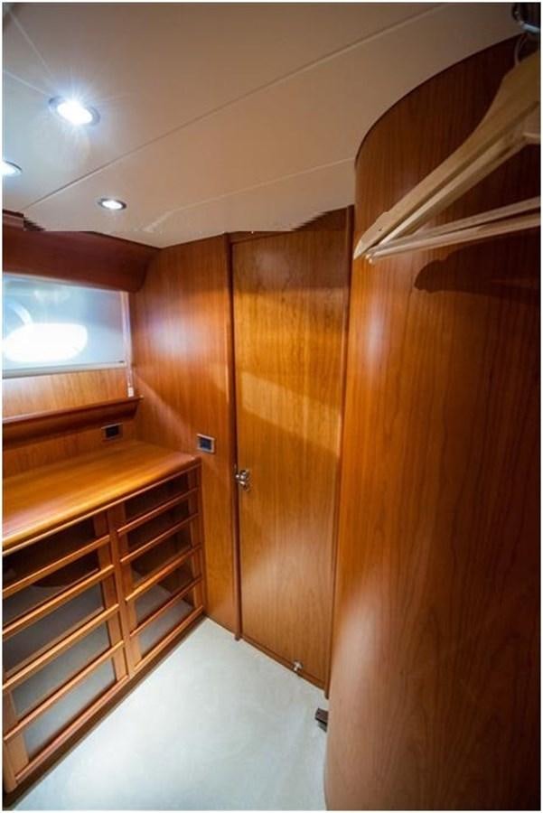 a room with wooden cabinets aboard P Yacht for Sale