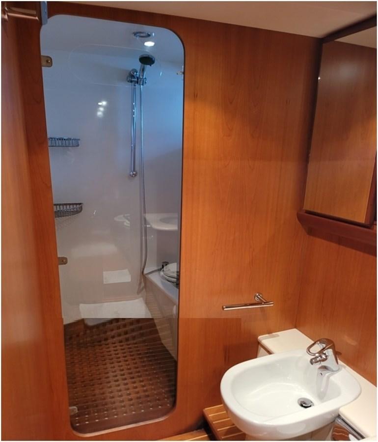 a shower unit and sink in a bathroom aboard P Yacht for Sale