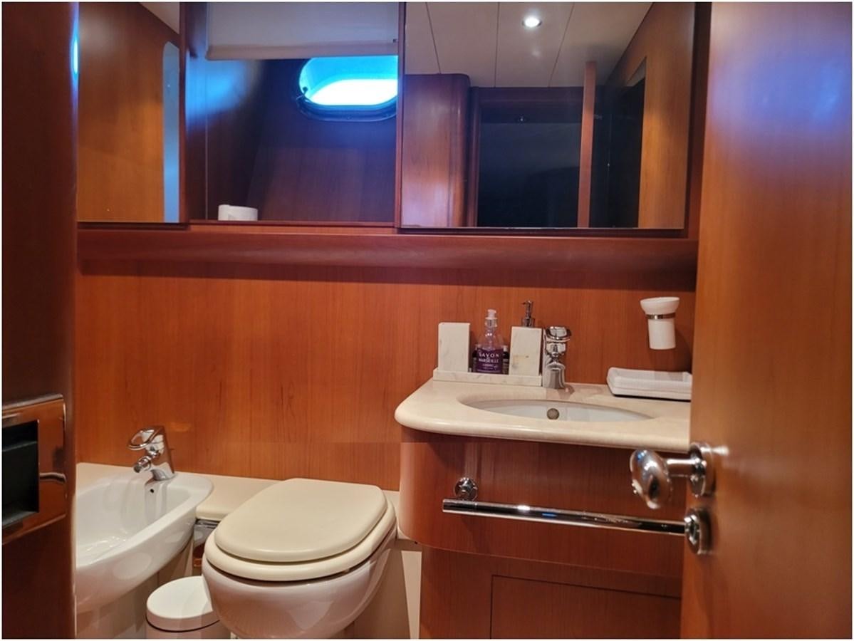 a bathroom with a sink and toilet aboard P Yacht for Sale
