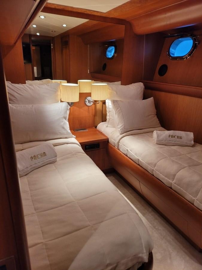a room with two beds aboard P Yacht for Sale