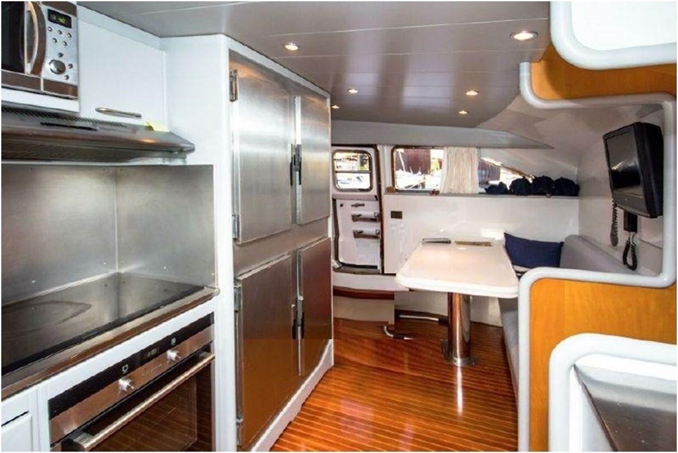 a kitchen with a large island aboard P Yacht for Sale