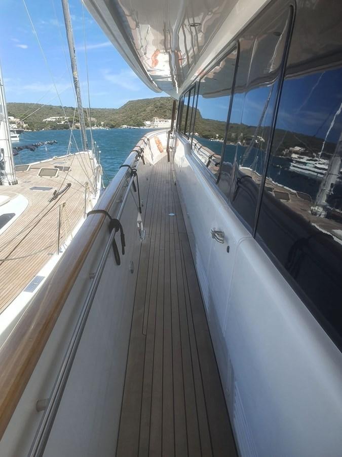 a boat with a large body of water in the background aboard P Yacht for Sale