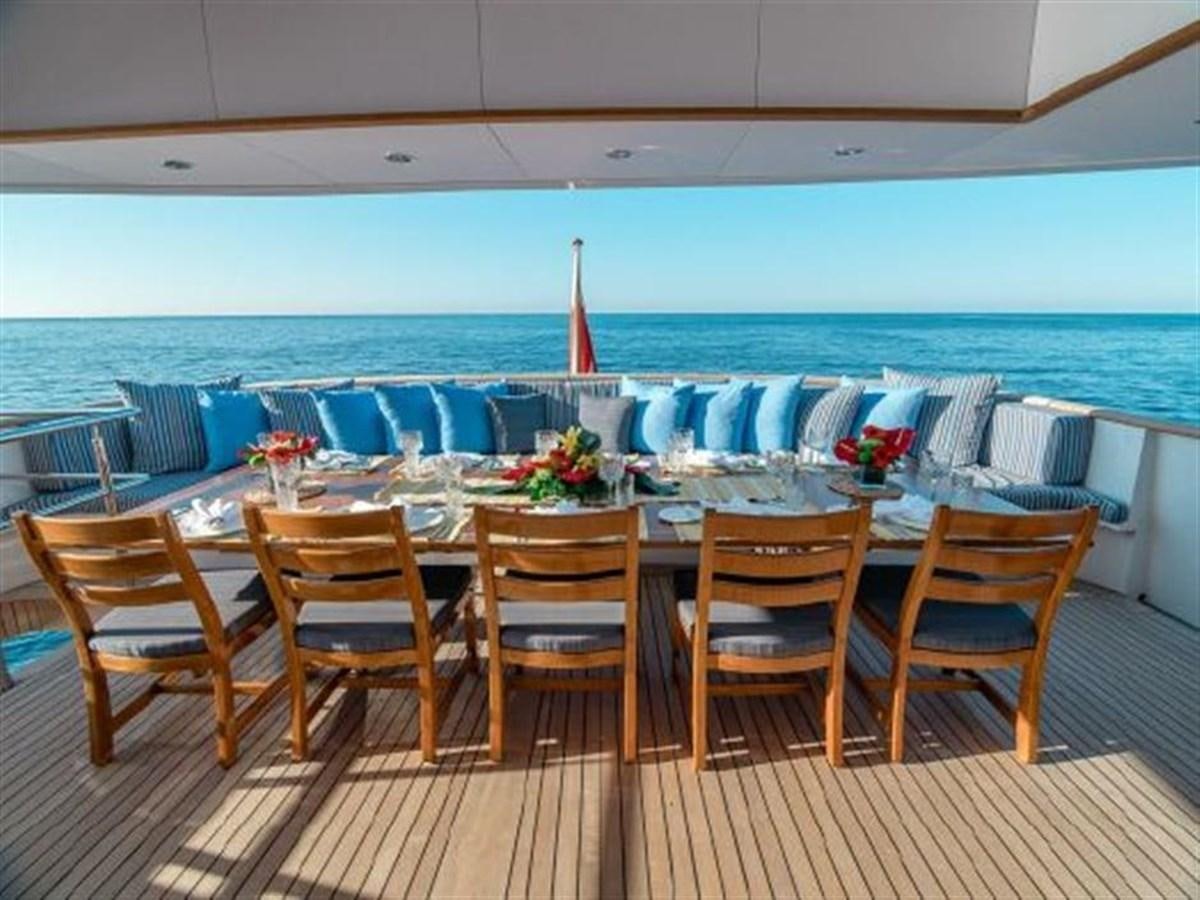 a table set for a dinner party aboard CHARISMA Yacht for Sale