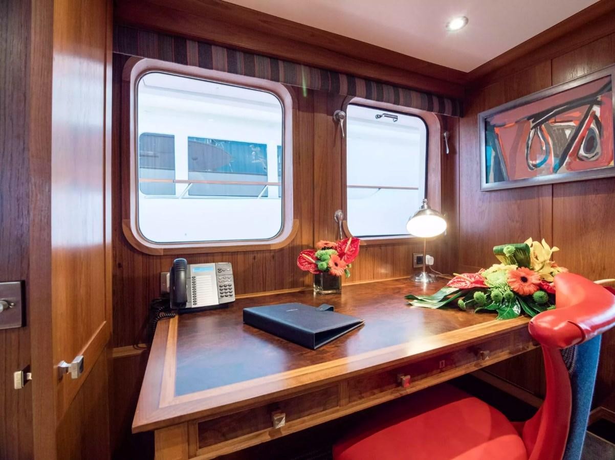 a table with a phone on it aboard CHARISMA Yacht for Sale