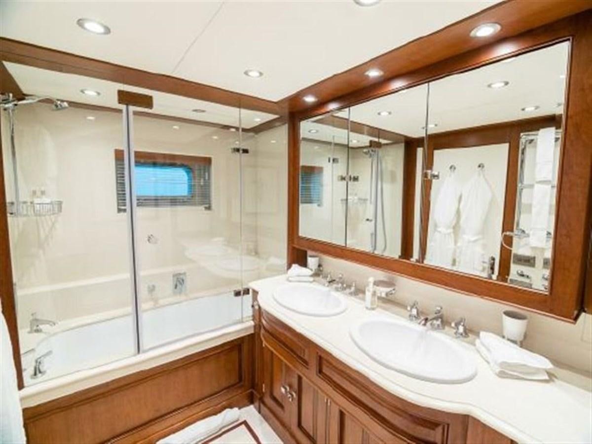 a bathroom with a large mirror aboard CHARISMA Yacht for Sale