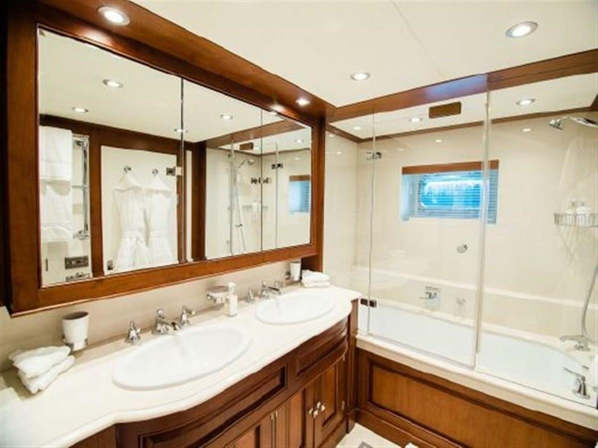 a bathroom with a large mirror aboard CHARISMA Yacht for Sale