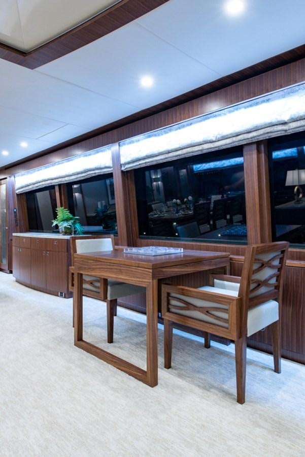 a table and chairs in a room aboard G120 SIGNATURE SERIES Yacht for Sale