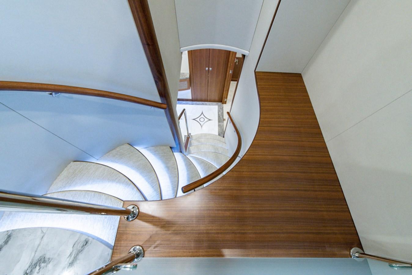 a wooden staircase with a white wall aboard G120 SIGNATURE SERIES Yacht for Sale