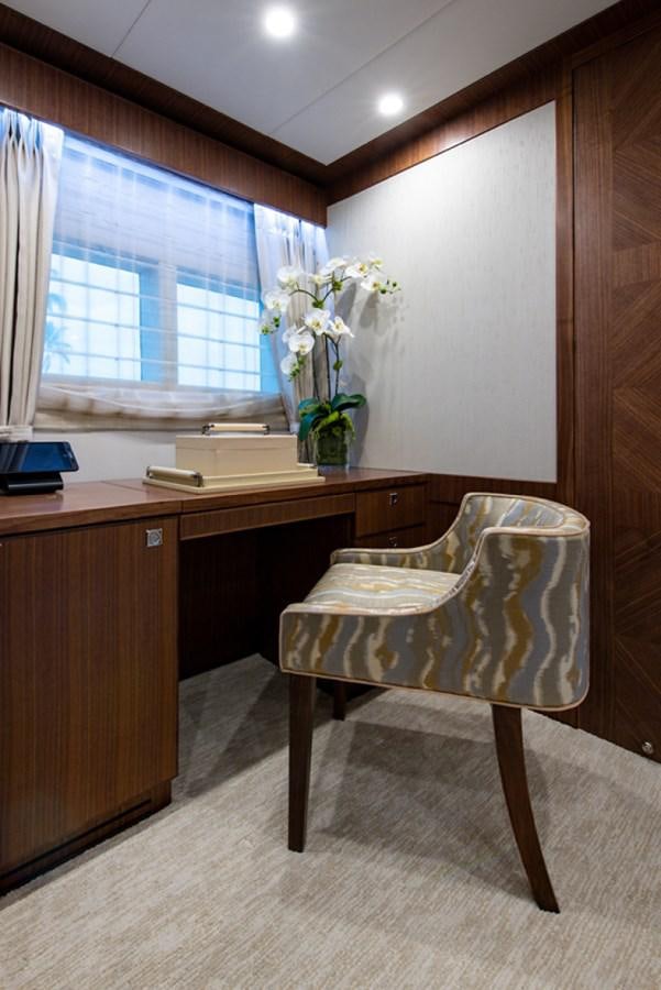 a chair and desk in a room aboard G120 SIGNATURE SERIES Yacht for Sale