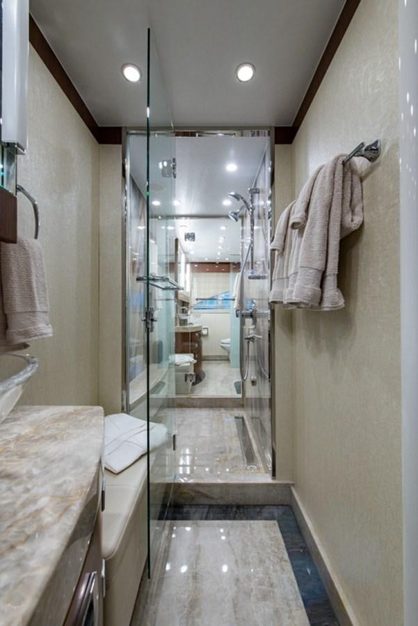 a bathroom with a glass shower aboard G120 SIGNATURE SERIES Yacht for Sale