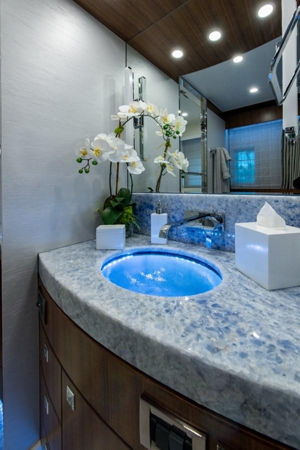 a bathroom with a sink and a mirror aboard G120 SIGNATURE SERIES Yacht for Sale