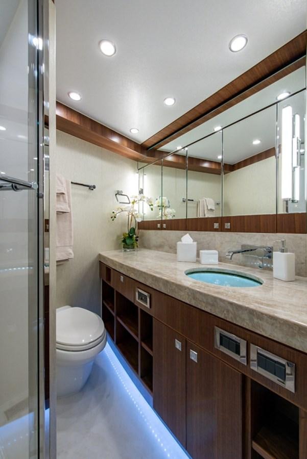 a bathroom with a sink and a toilet aboard G120 SIGNATURE SERIES Yacht for Sale