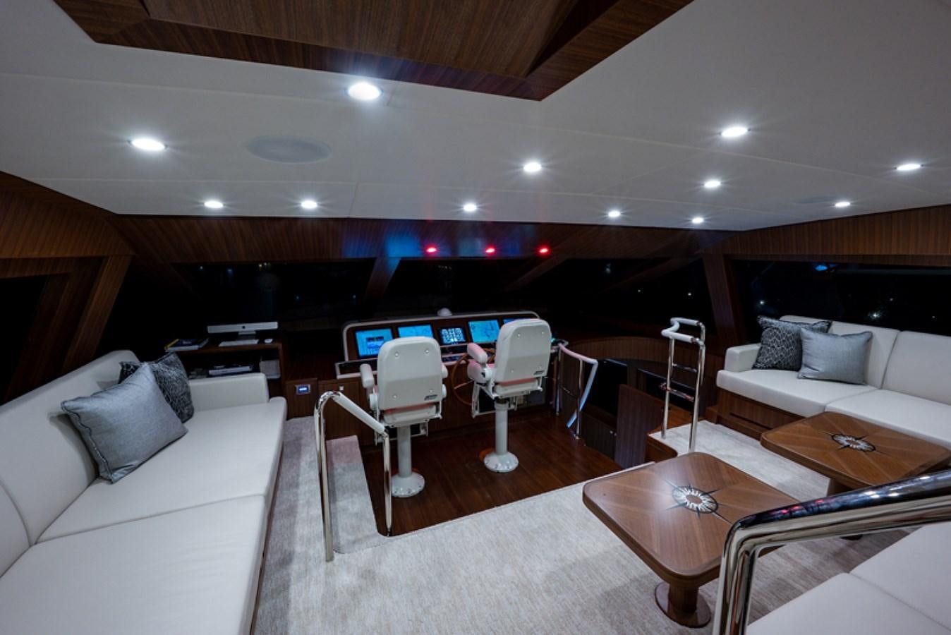 a living room with a table and chairs aboard G120 SIGNATURE SERIES Yacht for Sale
