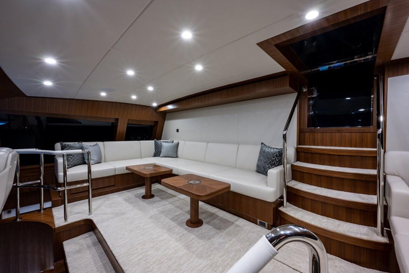 a living room with a couch and a table aboard G120 SIGNATURE SERIES Yacht for Sale