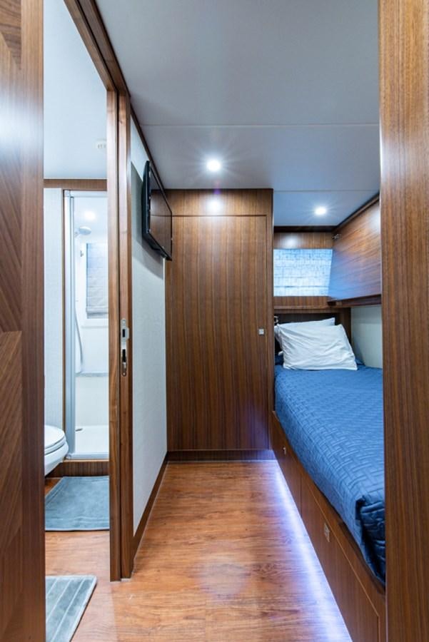 a bedroom with a bed and a closet aboard G120 SIGNATURE SERIES Yacht for Sale