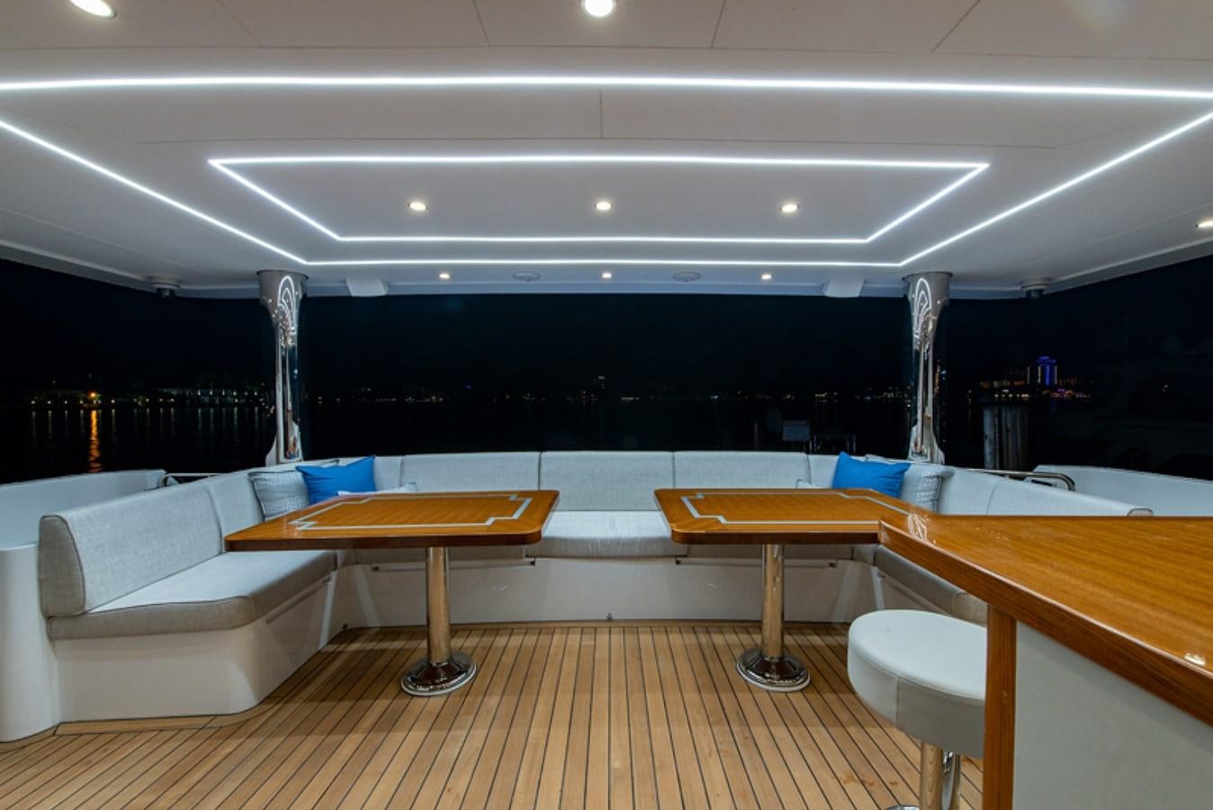 a room with tables and chairs aboard G120 SIGNATURE SERIES Yacht for Sale