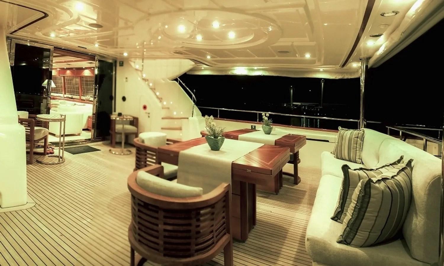 a room with a table and chairs aboard ARIELA Yacht for Sale