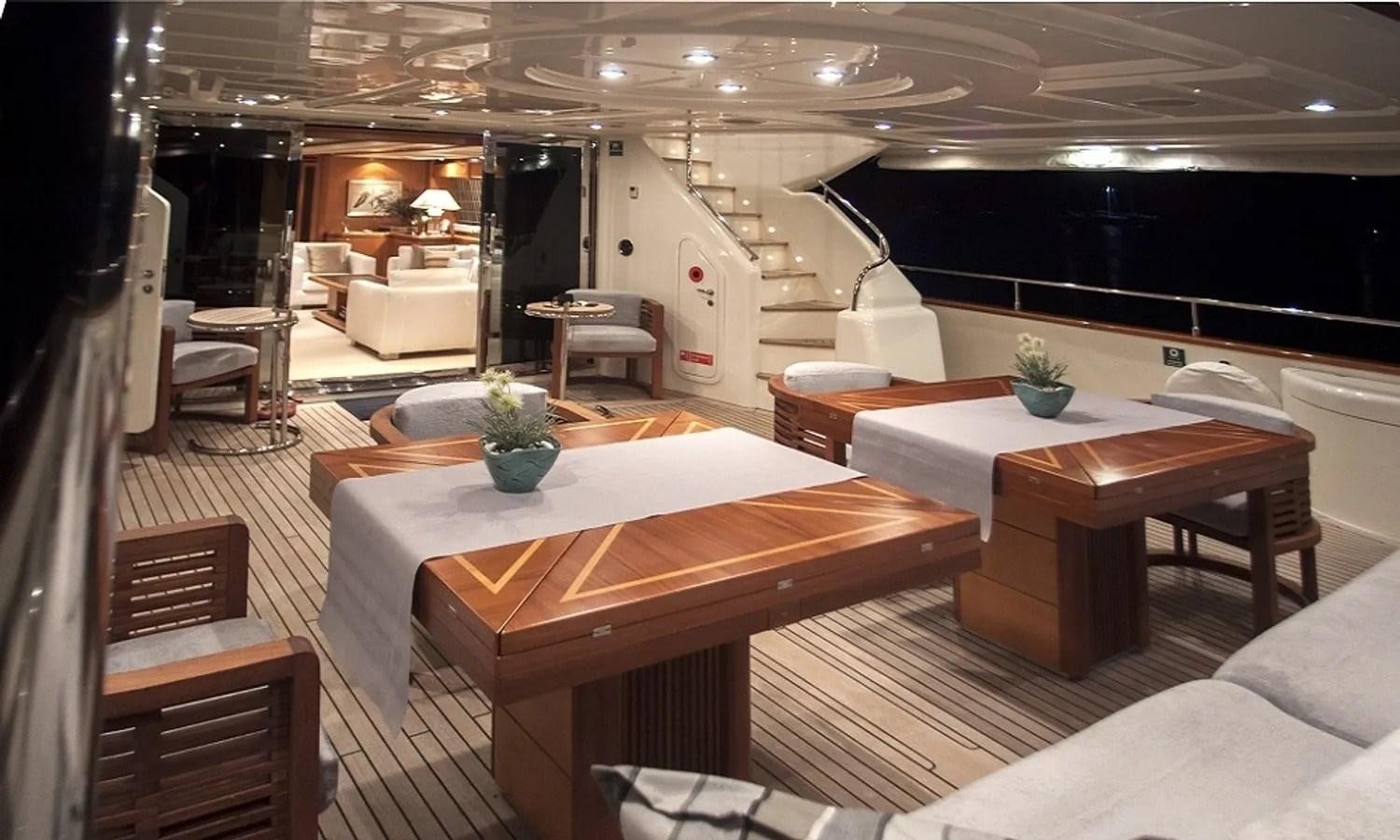a room with a table and chairs aboard ARIELA Yacht for Sale