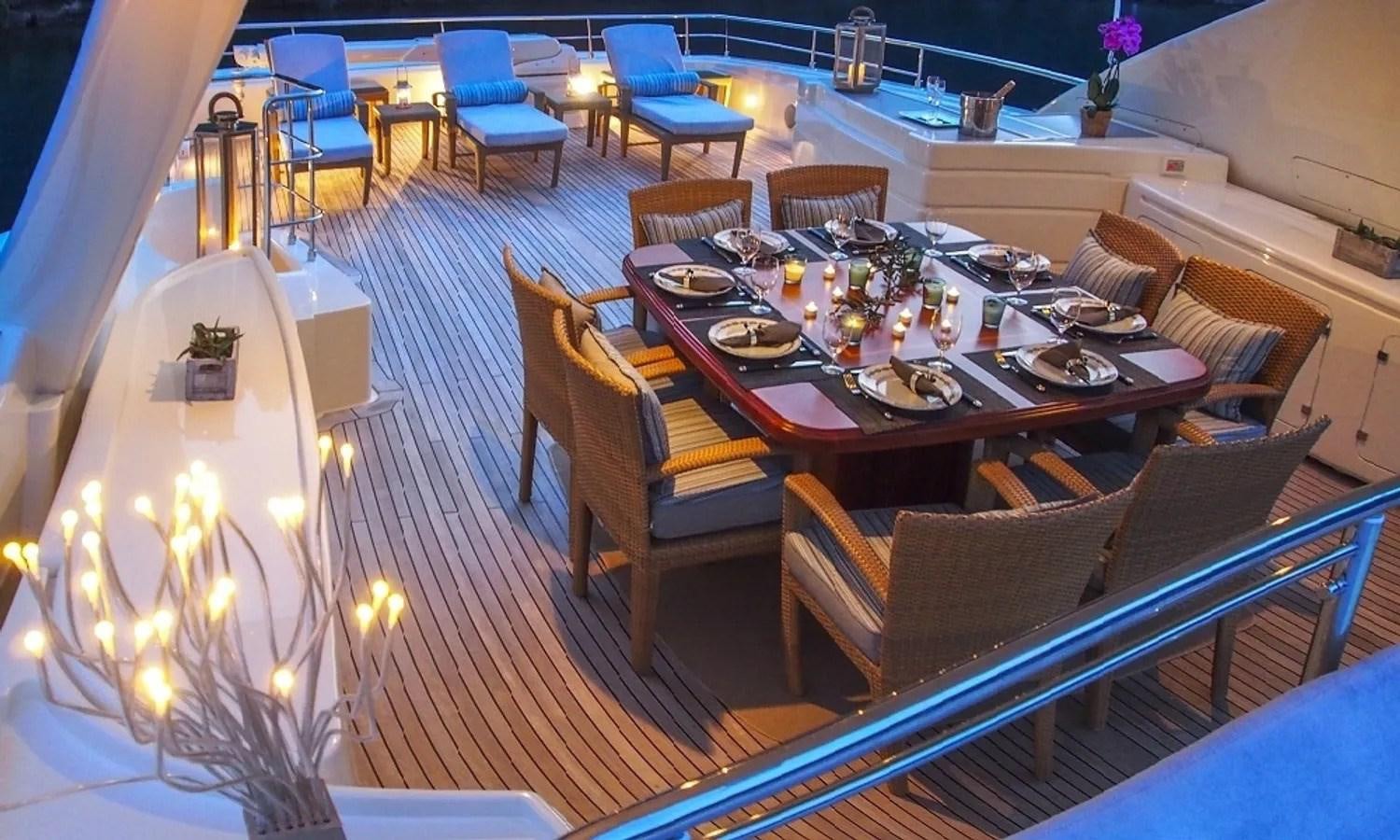 a dining room with a table and chairs aboard ARIELA Yacht for Sale
