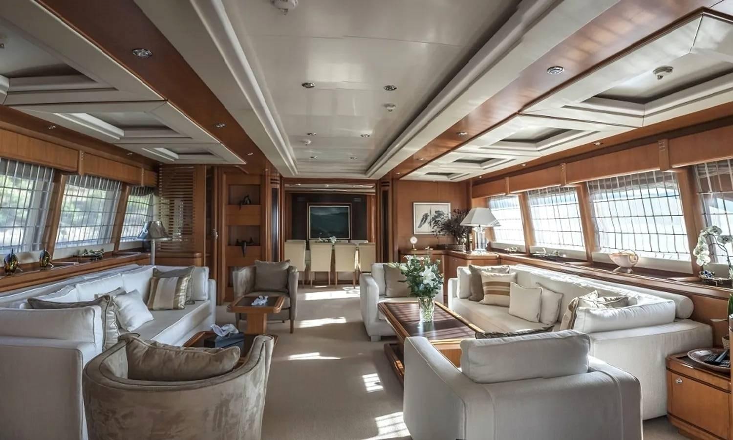 a large living room with a large window aboard ARIELA Yacht for Sale