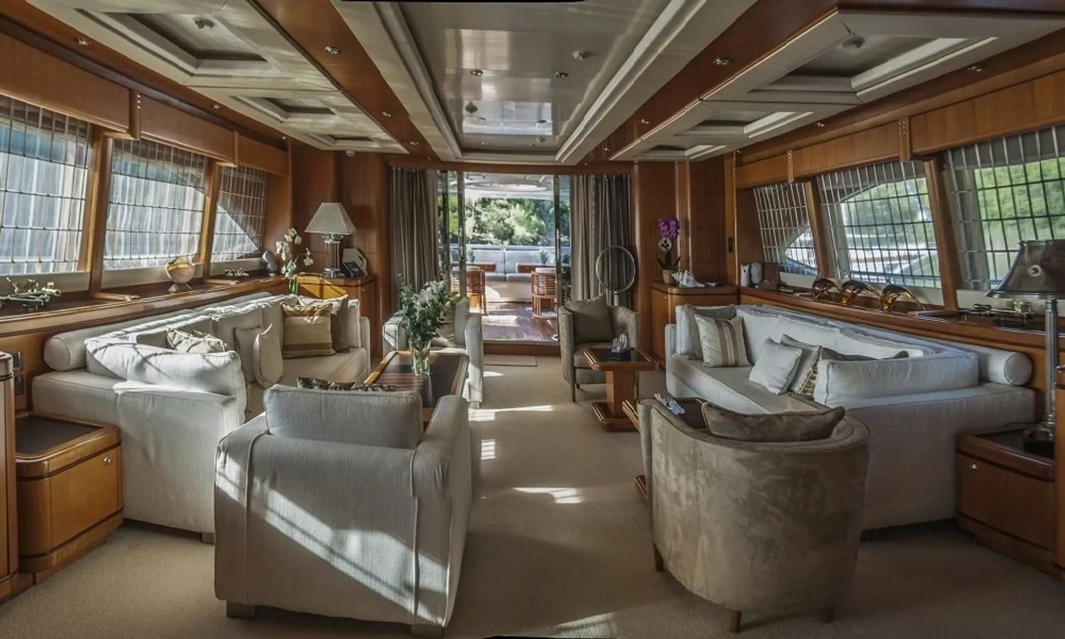 a large living room with a large bed and a large window aboard ARIELA Yacht for Sale