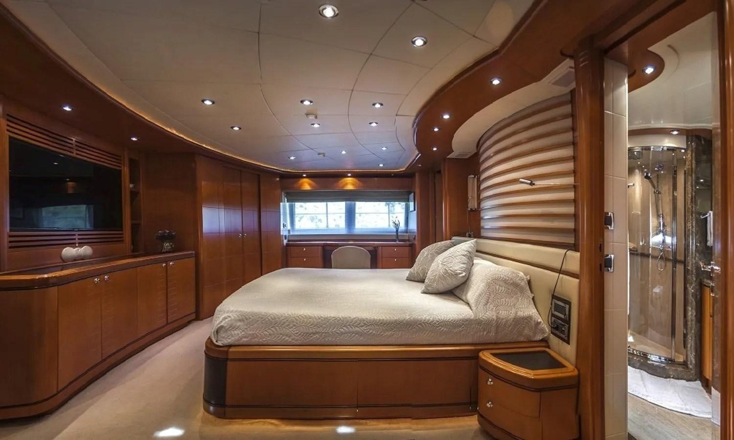 a bed in a room aboard ARIELA Yacht for Sale