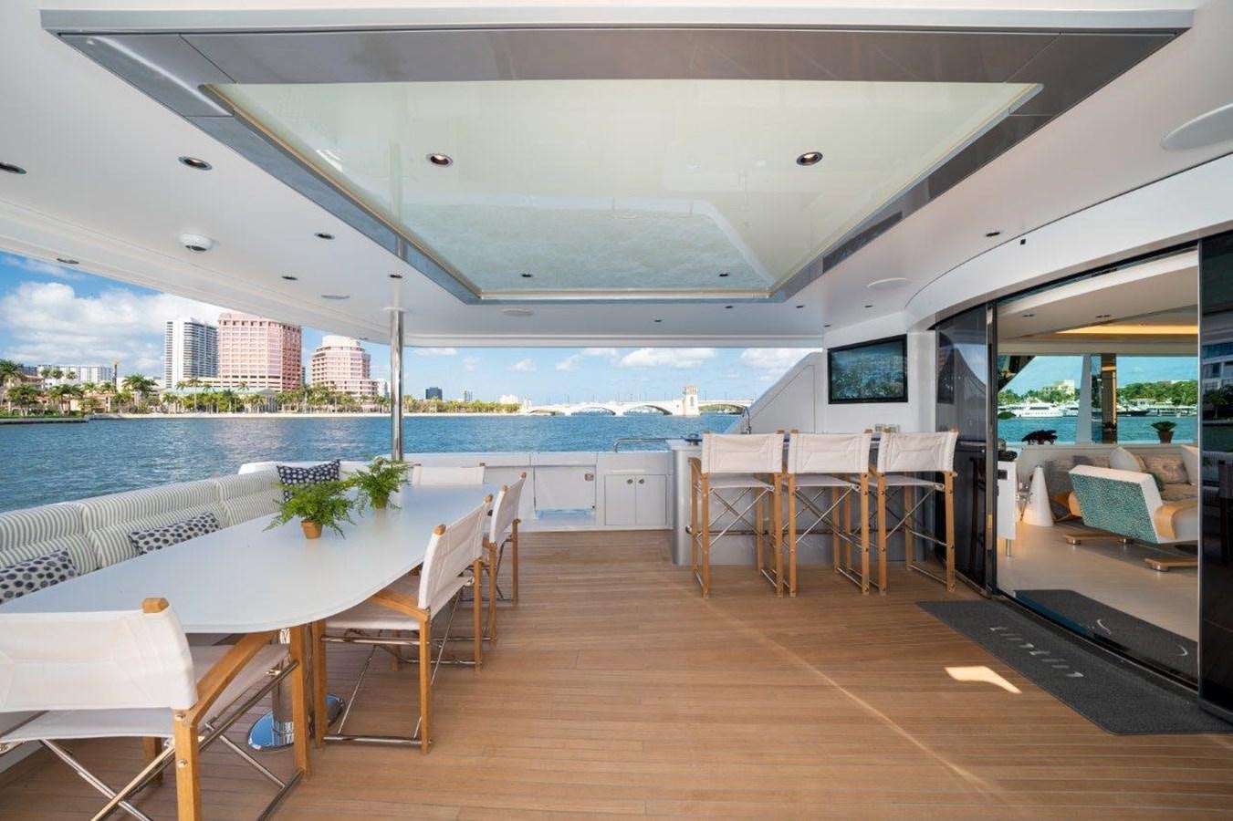 a room with tables and chairs aboard RING-N-WET Yacht for Sale