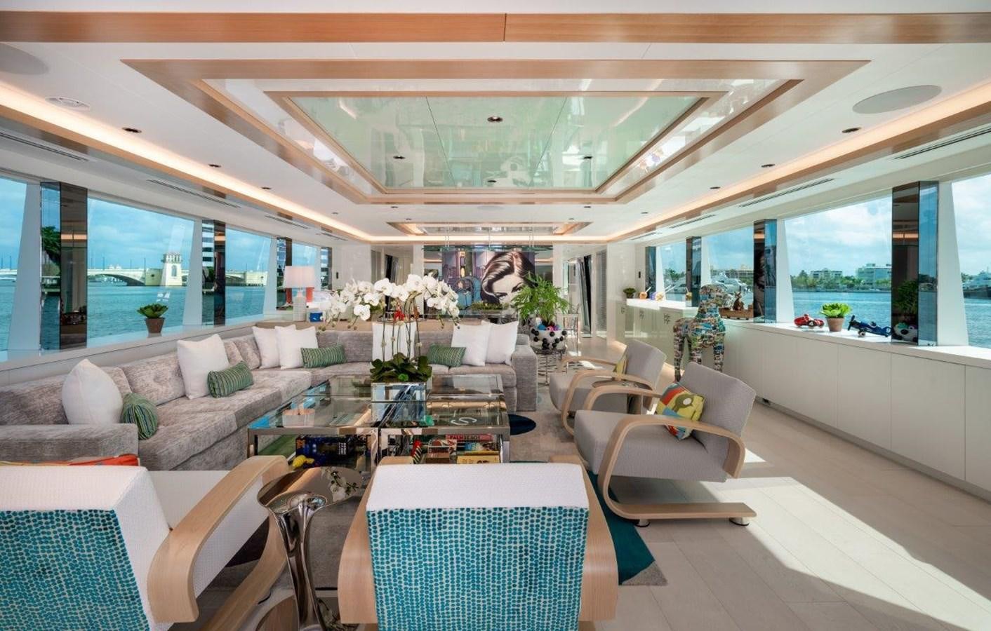 a living room with a large window aboard RING-N-WET Yacht for Sale