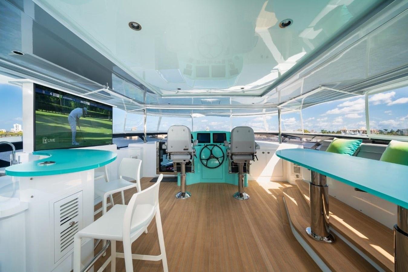 a room with a table chairs and a large window aboard RING-N-WET Yacht for Sale