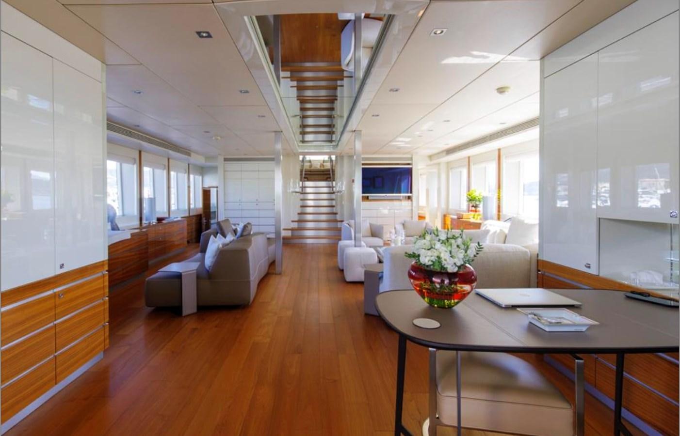 a living room with a wood floor aboard BASMALINA II Yacht for Sale