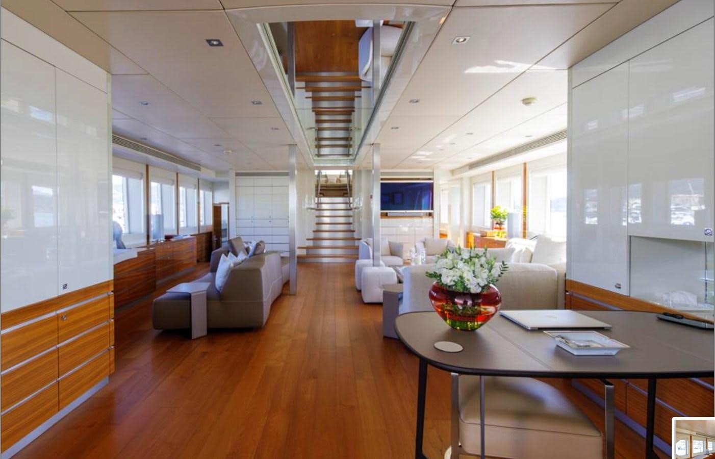 a living room with a wood floor aboard BASMALINA II Yacht for Sale
