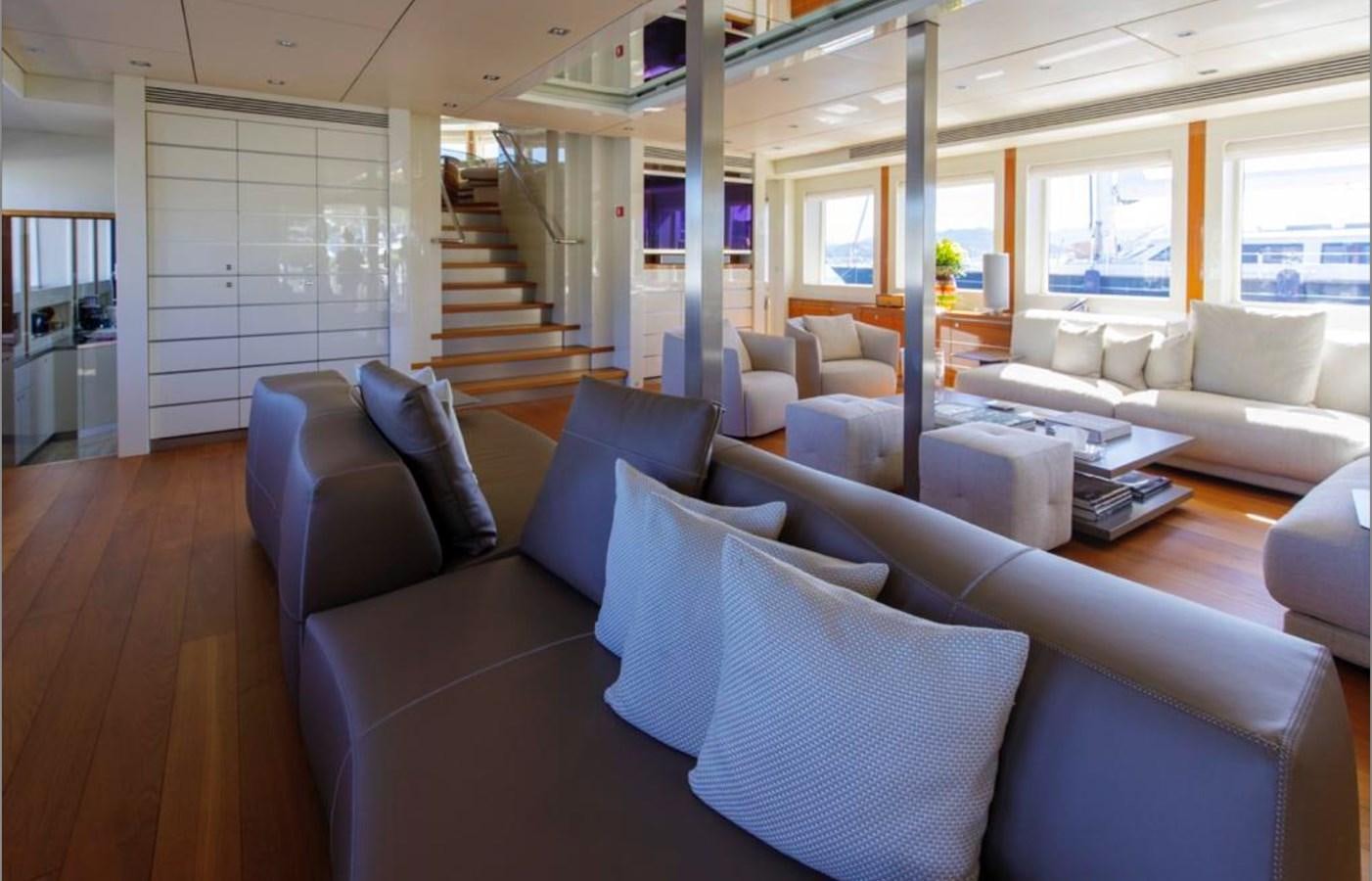 a living room with a large window aboard BASMALINA II Yacht for Sale