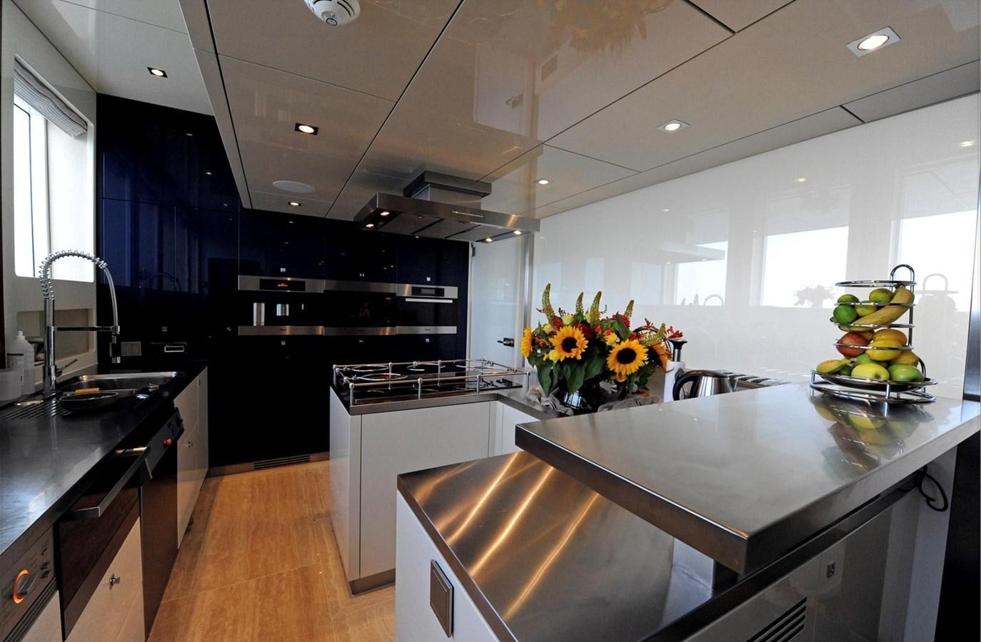 a kitchen with a marble counter top aboard BASMALINA II Yacht for Sale