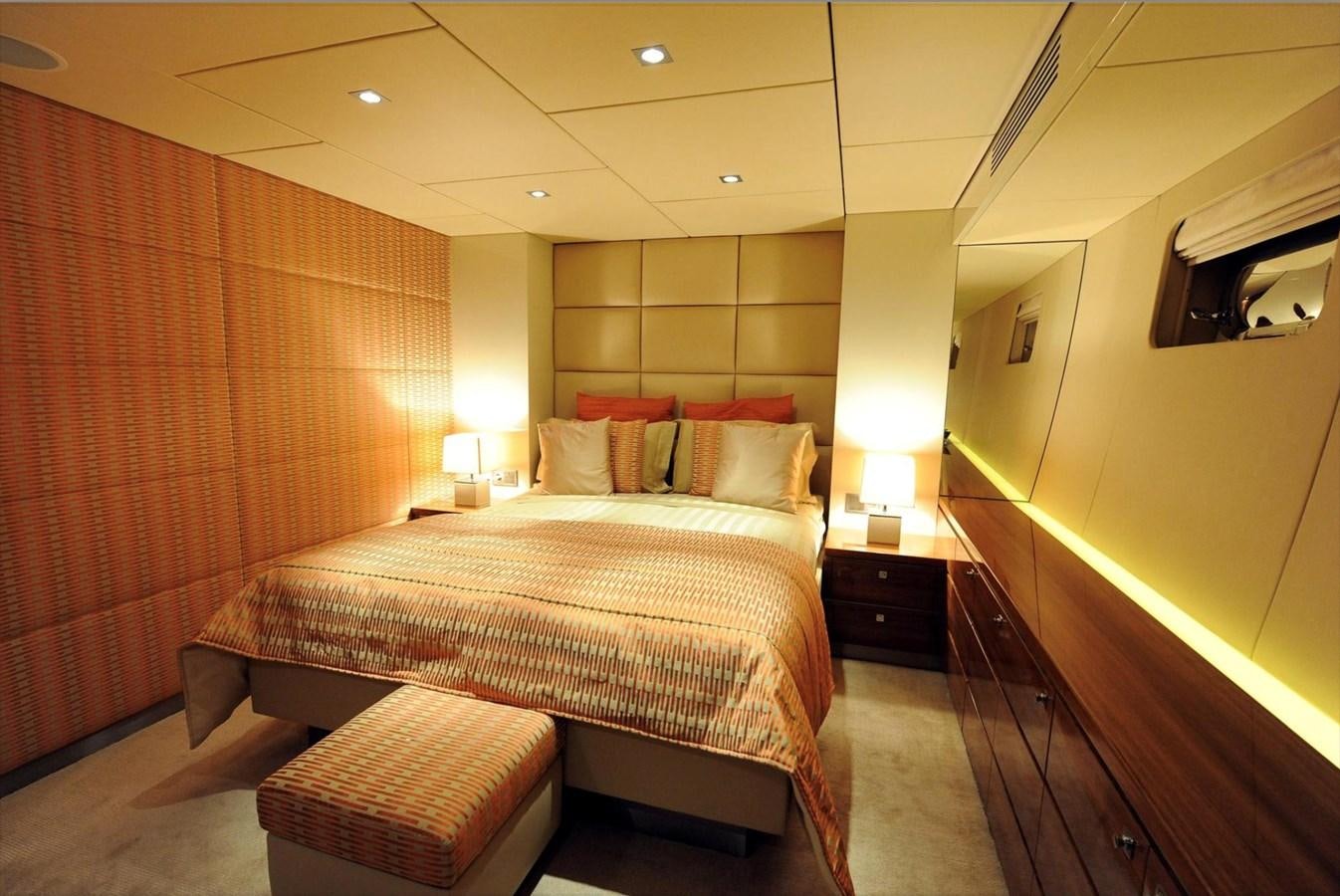 a hotel room with a bed and a curtain aboard BASMALINA II Yacht for Sale