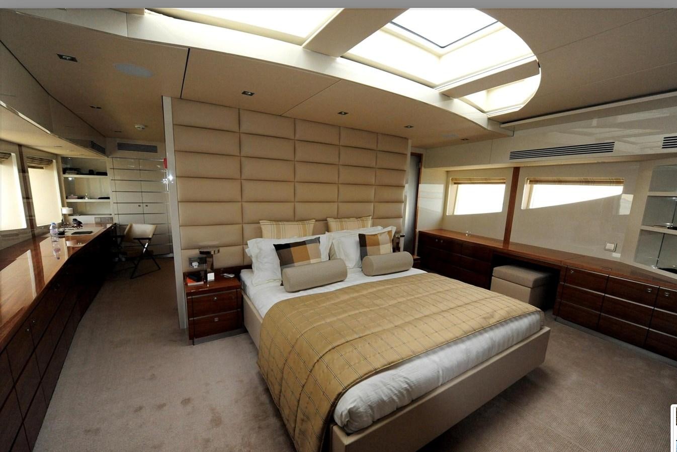a room with a bed and a desk aboard BASMALINA II Yacht for Sale