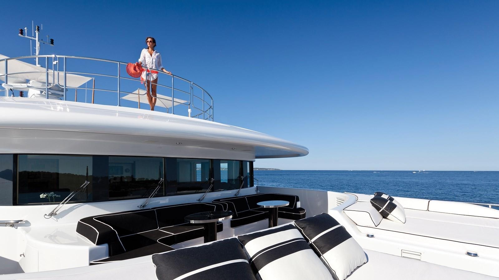 a person walking on a boat aboard STEP ONE Yacht for Sale