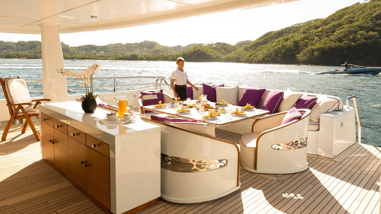 a person sitting on a boat aboard STEP ONE Yacht for Sale