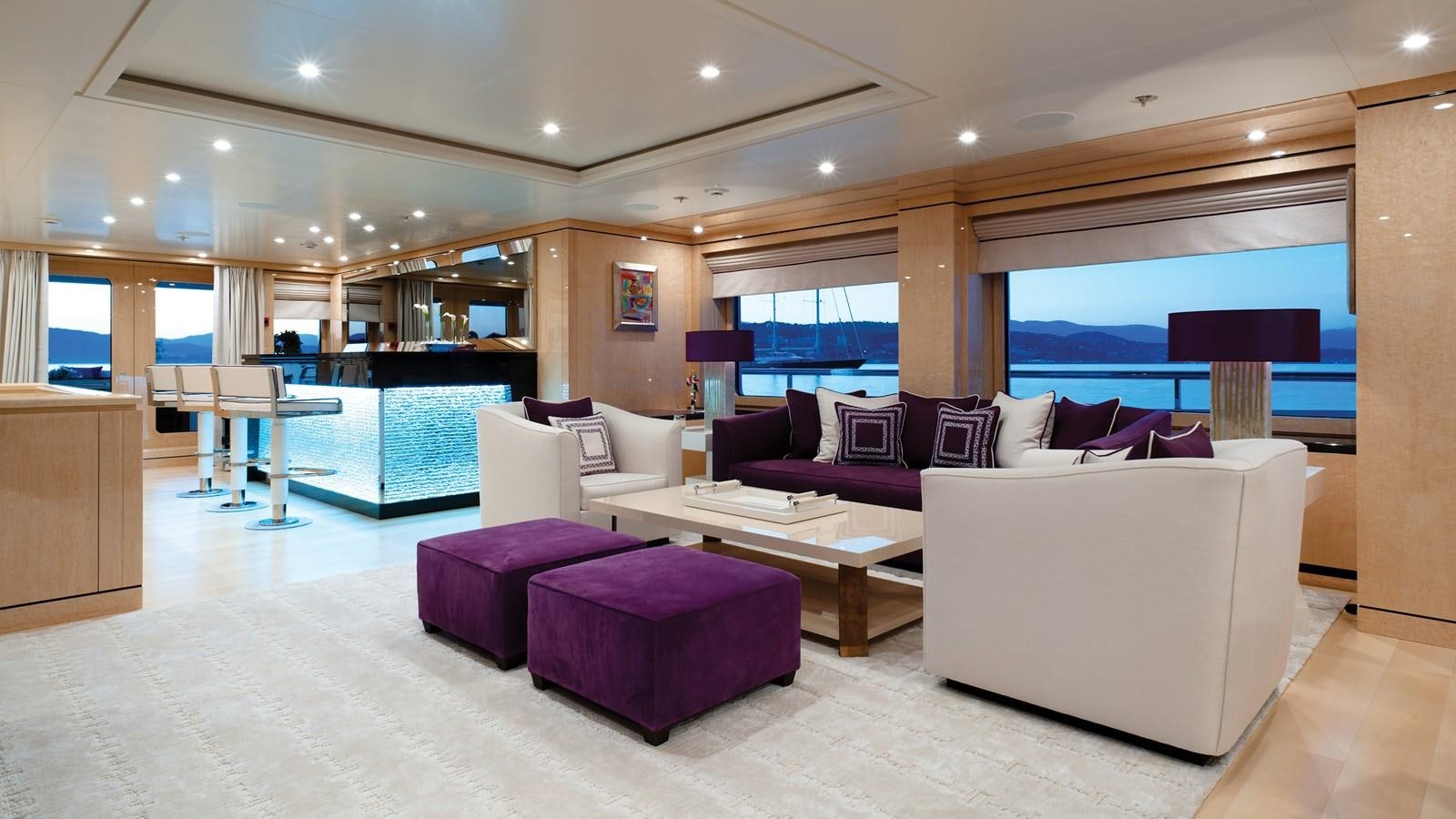 a large living room with a large window aboard STEP ONE Yacht for Sale