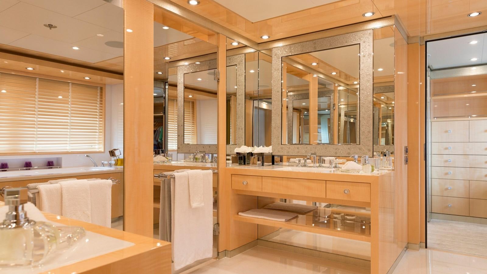 a large bathroom with a large mirror aboard STEP ONE Yacht for Sale