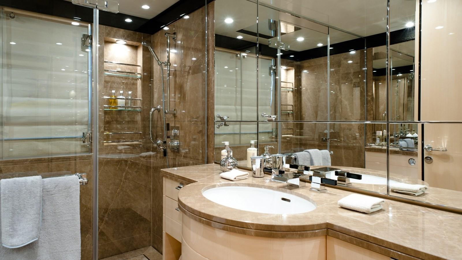 a bathroom with a large glass shower aboard STEP ONE Yacht for Sale